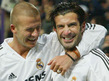 Beckham and Figo celebrating a goal